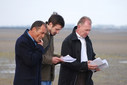 men on the shore